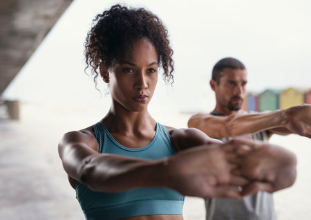 Were getting in shape together. a sporty young woman exercising with her boyfriend outdoors.