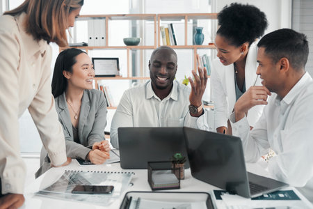 Business meeting, teamwork and laptop for diversity planning, ideas and strategy in office. Happy collaboration with men and women talking, discussion and brainstorming for innovation and visionの写真素材
