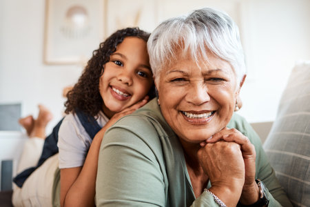 Dont lose your smile. a grandmother spending time with her grandchild at home.の写真素材