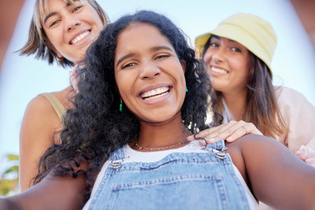 Selfie, portrait and friends relax at a park for bonding and having fun as a group. Face, women and...