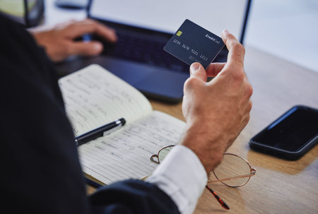 Banking, finance and hands with a credit card and a laptop for an online payment and planning...