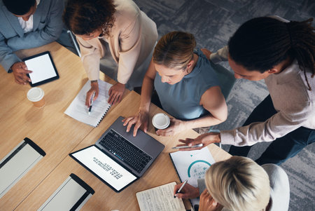Top view, business people and technology screen in meeting for teamwork planning, finance diversity or investment strategy. Corporate men, women and collaboration on laptop mockup and tablet mock upの写真素材