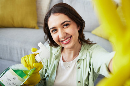 Woman, selfie and spray for cleaning home, portrait or smile in gloves, social media and chemical....