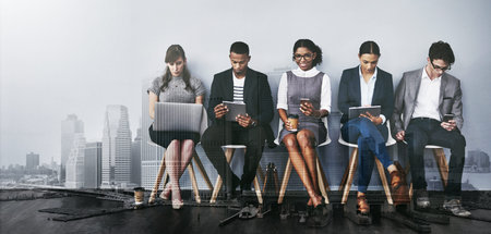 These seats are for those on the shortlist. Full length shot of a group of young businesspeople...