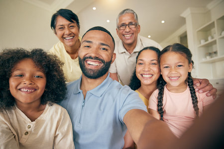 Happy, portrait of big family and selfie in home, bonding together and love. Face, profile picture and kids, grandparents and mother, father and children smile taking photo for memory on social mediaの写真素材