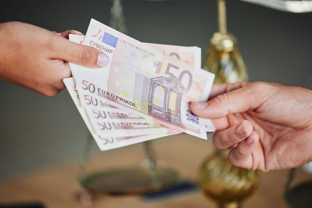 Money, hands and business people with a bribe for justice, legal work and payment for consultation....