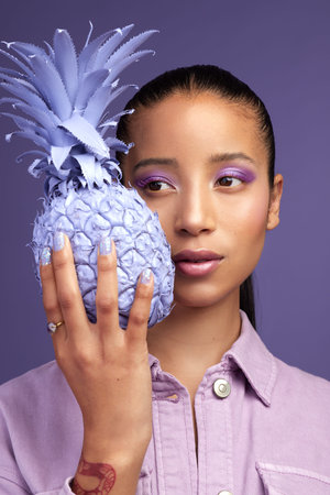 Soft on the inside and purple on the outside. Studio shot of a beautiful young woman modelling a...