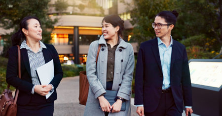 Walking, conversation and business people in the city talking for communication or bonding. Smile,...