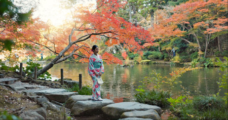 Walking, lake or calm Asian woman in park for journey on holiday vacation for freedom or wellness. Nature, travel or Japanese person with ideas for health, peace and inspiration to relax in forestの写真素材