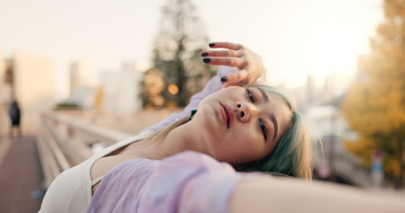 Outdoor, dancing and woman with routine, face and performance with training, artist and creative industry. Japan, contemporary dancer or girl with summer, movement and talent with practice and energyの写真素材