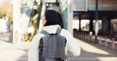 Walking, thinking and Japanese student in city on commute, travel and journey in metro. Student,...
