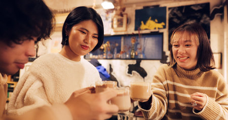Japanese friends, cheers and coffee in restaurant for dinner, vacation and hot drinks to celebrate...