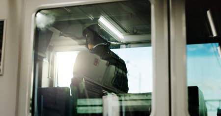 Train, conductor and window or transportation for travel Japan, control room or adventure. Male...