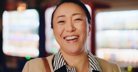 Japanese, woman and face with laughing in city for comedy, joke or funny story with travel to...