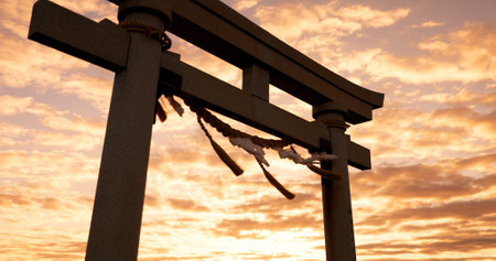 Torii gate, sunset and cloudy sky with zen, peace and spiritual history on travel adventure in Japan. Shinto architecture, Asian culture and calm nature on Japanese landscape with sacred monument.の写真素材
