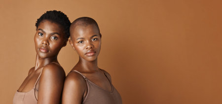 Wellness, face or black women with beauty, glowing skin or results isolated on brown background. Facial dermatology, African models or natural cosmetics skincare in studio with girl friends or peopleの写真素材