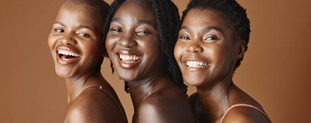 Face, beauty and laughing with black woman friends in studio on a brown background for natural wellness. Portrait, skincare and funny with a group of people looking happy at antiaging treatmentの写真素材