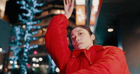 Japanese, woman and portrait with dancing outdoor at night in streetwear, trendy outfit or fashion....