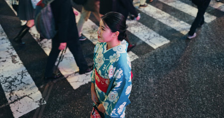 Woman, Japanese traditional clothes and walk in city, view and travel with journey outdoor. Fashion, adventure and urban street in Kyoto, kimono or dress for culture and style with local tripの写真素材