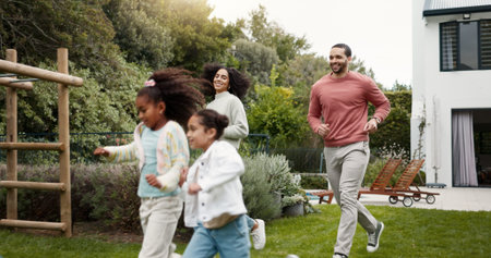 Family, running and children outdoor in backyard for playing, happiness and bonding at home. Young...