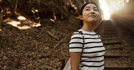 Nature, travel and Japanese woman in park for adventure on holiday, vacation and morning in woods....