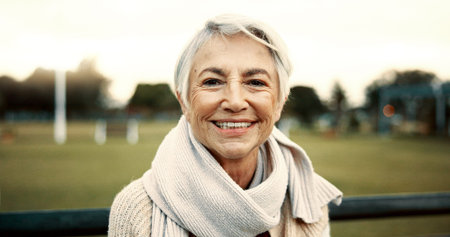 Face, senior woman and smile on park bench on vacation, holiday or travel in winter. Portrait, happy...