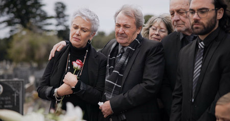 Death, funeral and elderly couple sad together at pain or grief for death and loss during a...