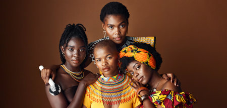 African women, group and studio for culture with face, jewelry or beads necklace in clothes by background. Black people, model and indigenous fashion for friends, traditional or portrait for kwanzaaの写真素材