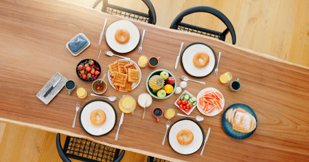Healthy, breakfast and food on dining table with top view, fruit and coffee for wellness and...