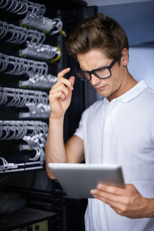 Server room, information technology and man for thinking, tablet or check connectivity at night job....