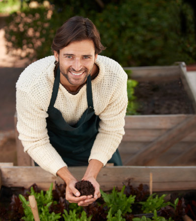 Portrait, farmer and man with soil for agriculture, smile and ecology for sustainability of nature....