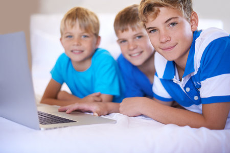 Children, home and portrait on laptop in bedroom, smile and excited for online games in house. Young...