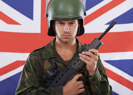 Military, Britain and gun with portrait of man in studio for war, conflict and patriotic. Army,...