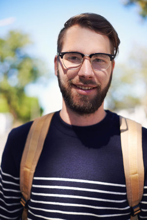 Man, portrait and university student in outdoors, smile and morning commute to college. Happy male...