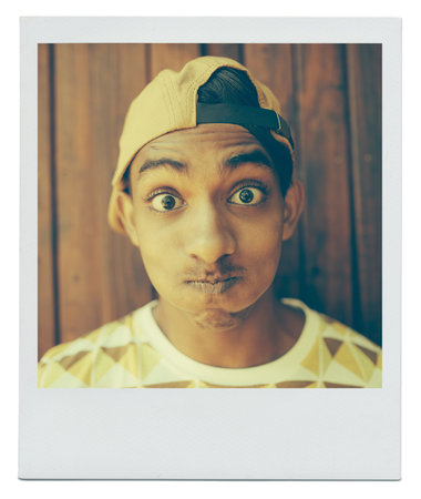 Portrait, funny face and teenager in home with picture at apartment with wood background in India....
