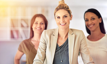Business people, portrait and confident for collaboration in teamwork, smile and company pride. Employees, women and leader of startup or support in office, partnership and solidarity in workplaceの写真素材