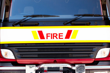 Closeup, fire truck and emergency service with front, safety and occupation with rescue and grill....