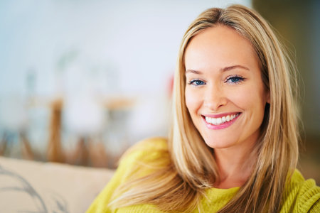 Happy, portrait and woman relax on a sofa in a house with confidence, chilling or good mood at home....