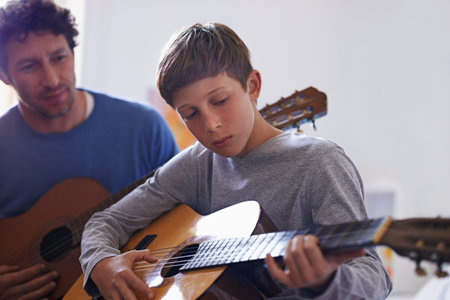 Learning, guitar and child with teacher for music, lesson and development of skill with instrument....