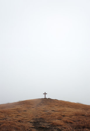 Christian cross, sky and religious symbol on hill or landscape for praying, ritual and spiritualの素材
