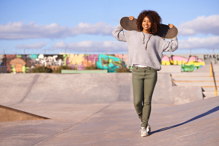 Skatepark, woman and summer for skate, recreation and fun outdoor for active and game for break or holiday. African person and happy for performing, trick and sports for wheel and action on mockupの写真素材