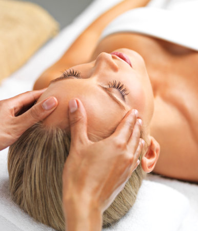 Closeup, girl or hand in spa, massage or relax of mind, wellness or luxury as self care and mental health. Head, client or peace to oil, facial or sleep of dream, salon table or cosmetology therapyの写真素材