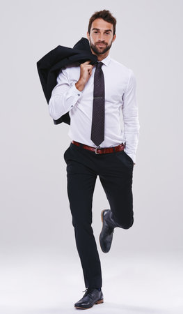 Studio, lawyer and standing with style, confidence and planning for professional fashion. Businessman, attorney and consultant with ideas, vision and startup in career isolated on white backgroundの写真素材