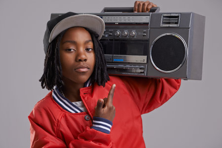 Black child, serious and portrait with radio and hand sign for hip hop, rap and swag with cool...