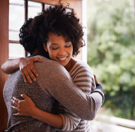 Smile, couple and hug at door for welcome, greeting or meeting together in home. Happy woman, man and embrace at doorway for visit, support and romantic connection for love in healthy relationshipの写真素材