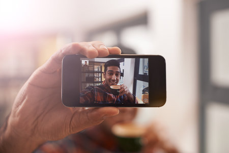 Smartphone, screen and selfie with man, hand and photography for social media, live streaming and memory. Closeup, influencer with content creation and communication, mobile app and smile in pictureの写真素材