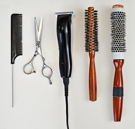 Scissors, equipment and tool for haircut, comb and razor for professional hairdresser. Metal, grooming and trim or cut from beautician or haircare service, electric barber or sharp clippers for salonの写真素材