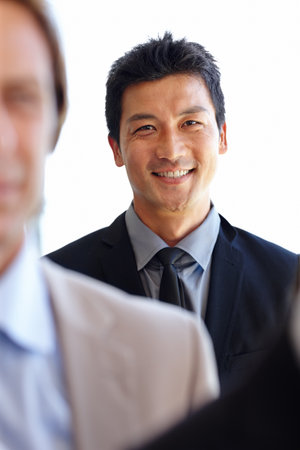 Asian, businessman and entrepreneur in portrait for career, employment or work in suit for meeting. Executive, ceo or manager smiling in professional outfit for corporate, occupation and jobの写真素材