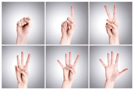 Fingers, mathematics and sign numbers in studio for counting or education purpose on gray...