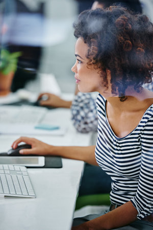 Business woman, working and computer with planning in office with idea and graphic design project. Staff, professional and startup with a digital employee at a desk with email for company websiteの写真素材